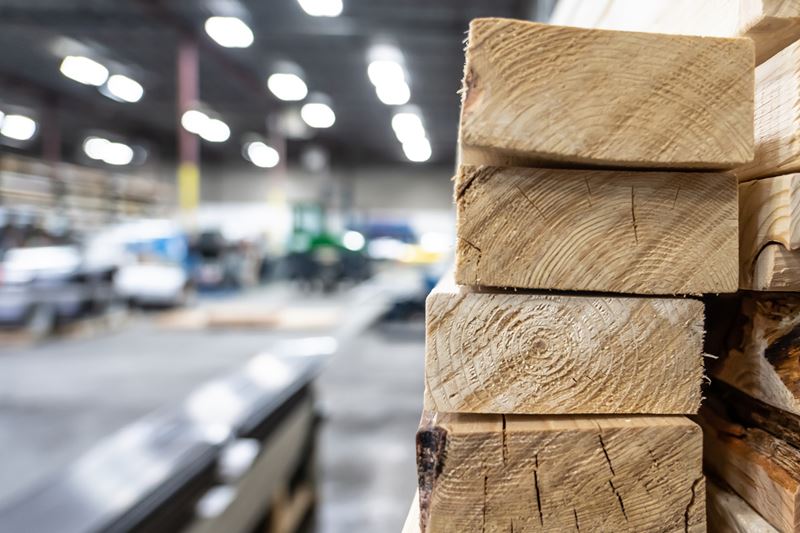 stacked lumber pieces in a warehouse
